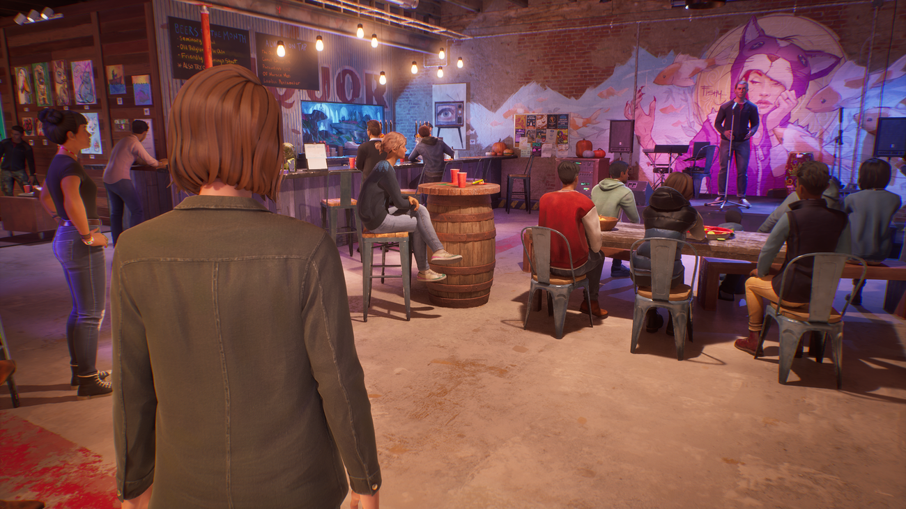 Chloe watches comedy at a cafe in Life is Strange: Reunion.