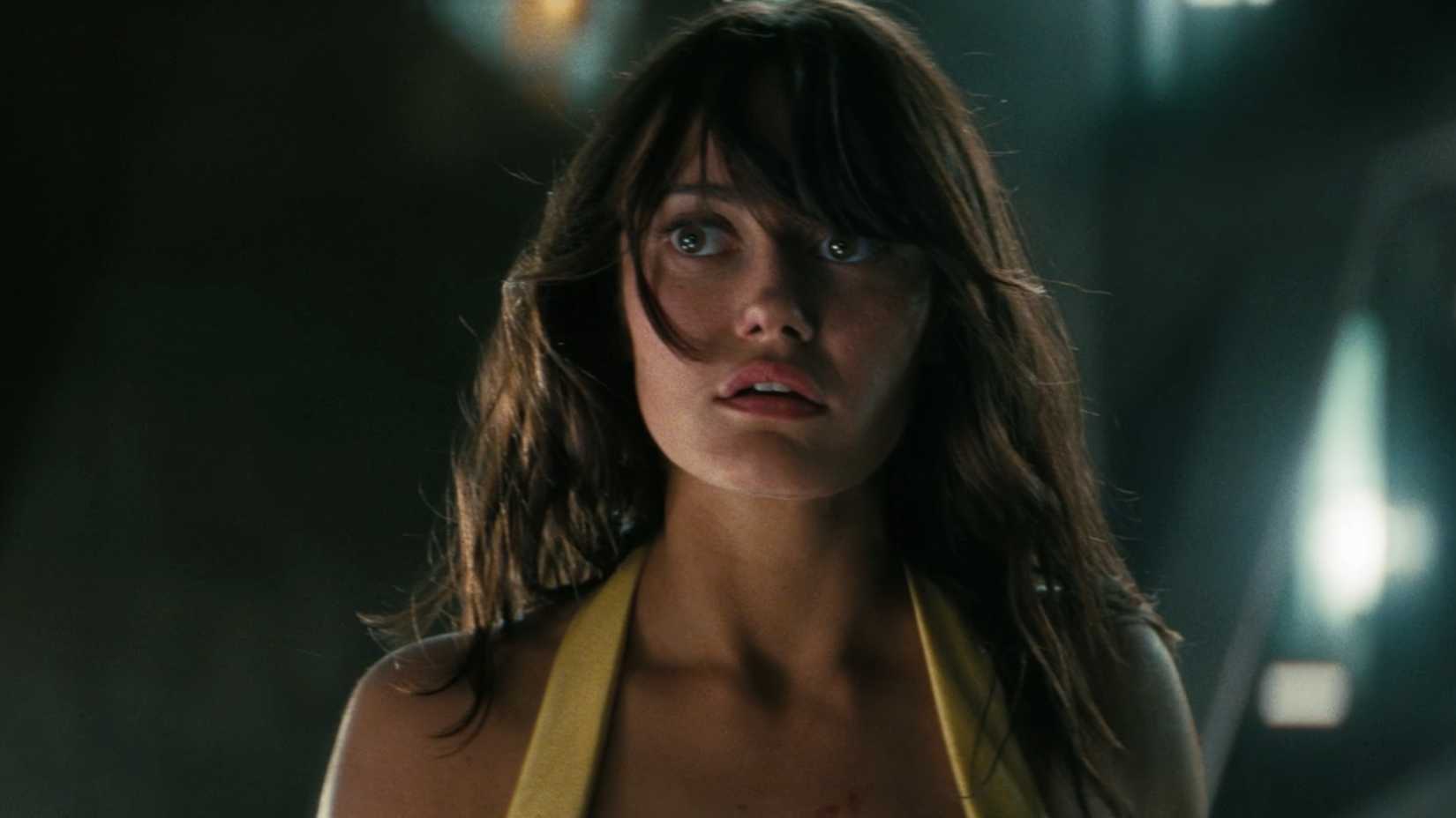 Lucy stares at The Ghoul in disbelief after he rescues her from her father, Hank.