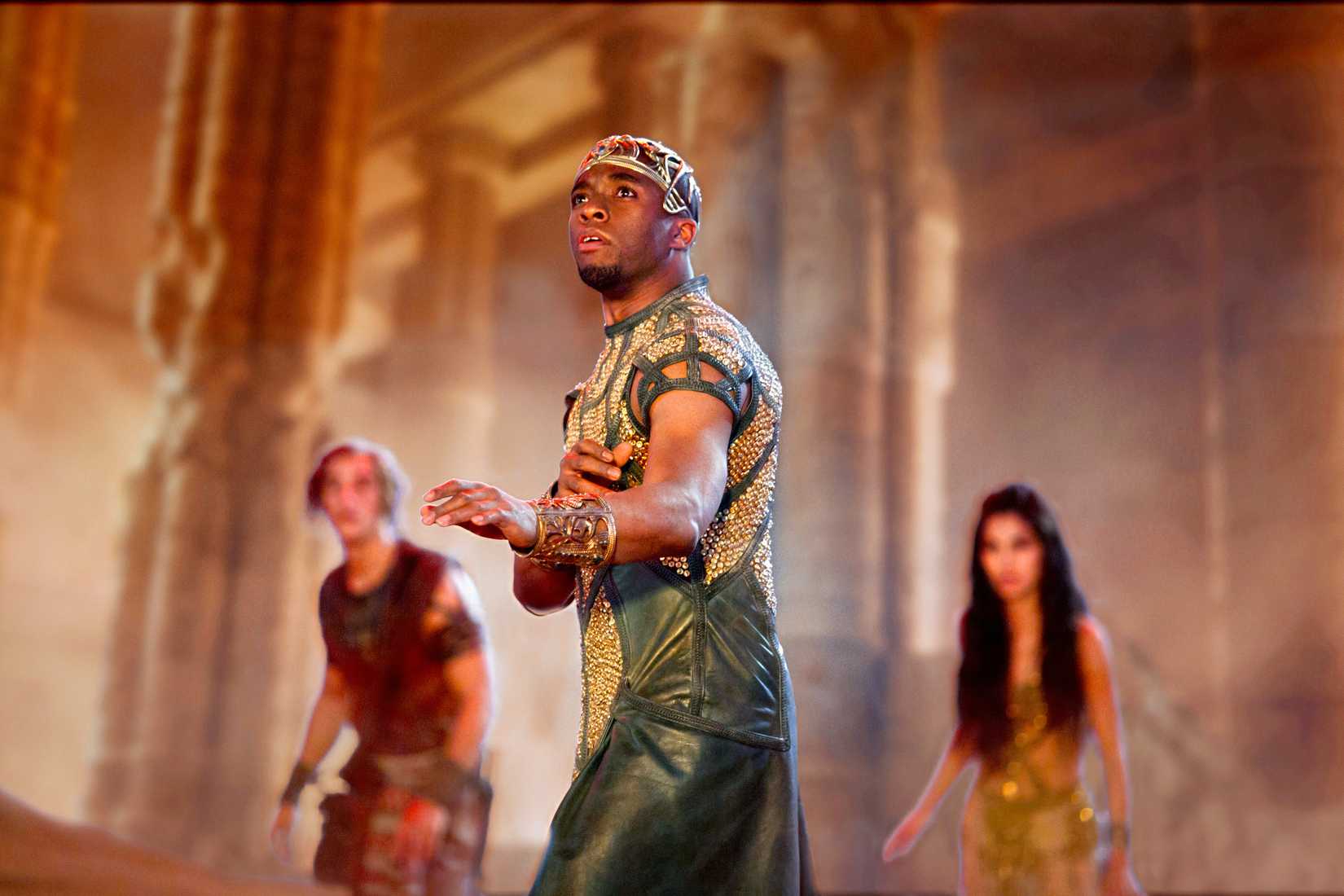 Chadwick Boseman as Thoth, god of wisdom, looks upwards in Gods of Egypt