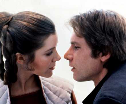 Princess Leia (Carrie Fisher) and Han Solo (Harrison Ford), in extreme close-up, seem juuuuuust about to kiss in The Empire Strikes Back