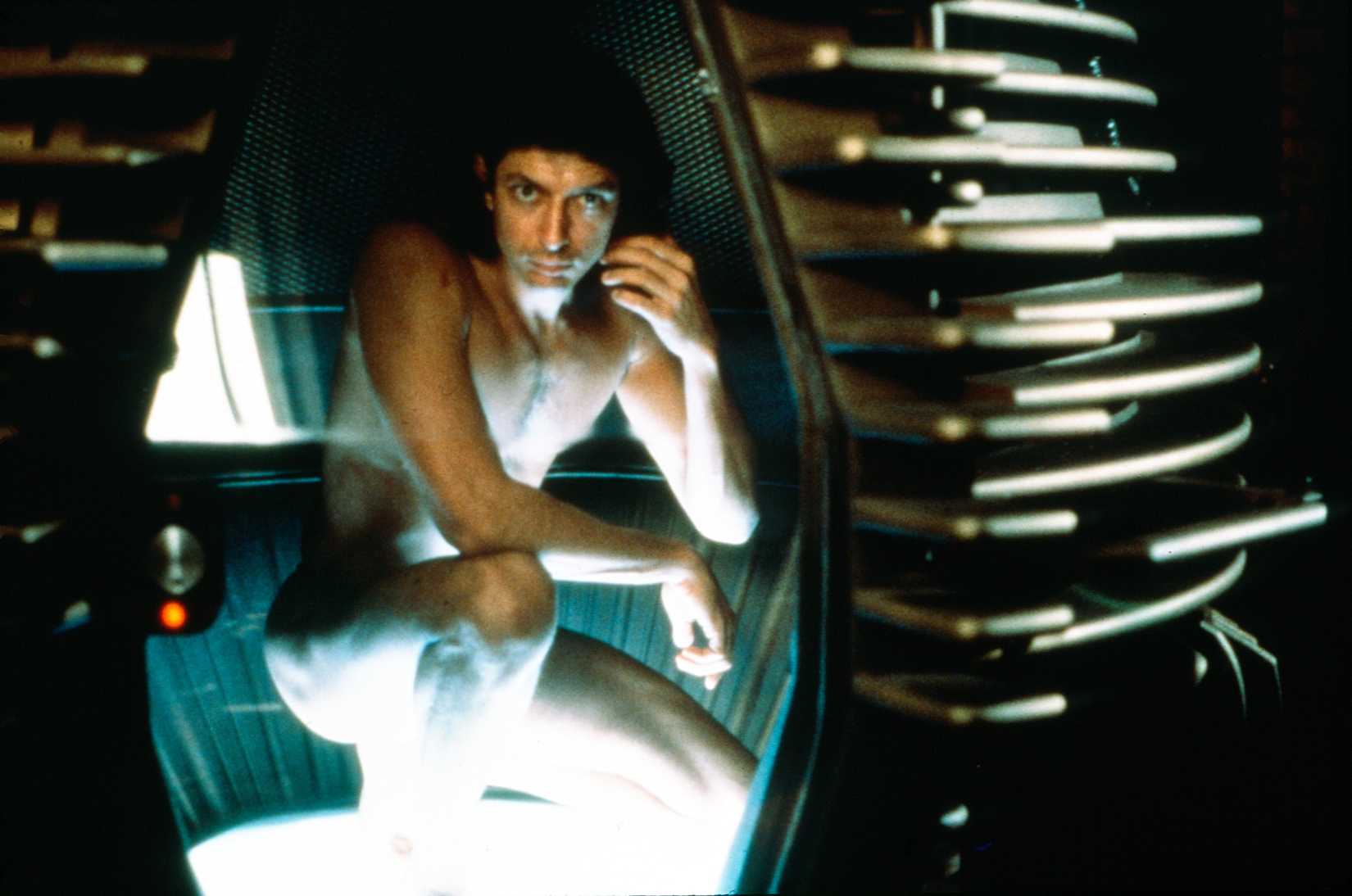 Jeff Goldblum broods naked inside his teleporter in The Fly