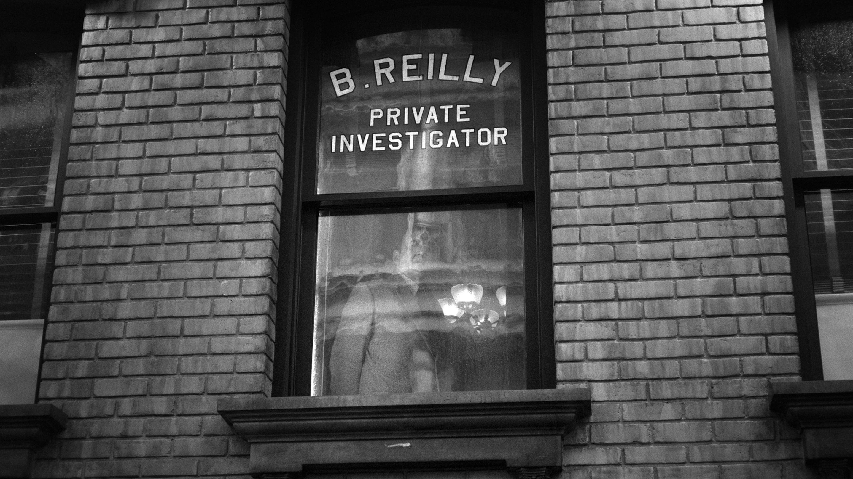 A noir-style window graphic reading "B. Reilly Private Investigator"