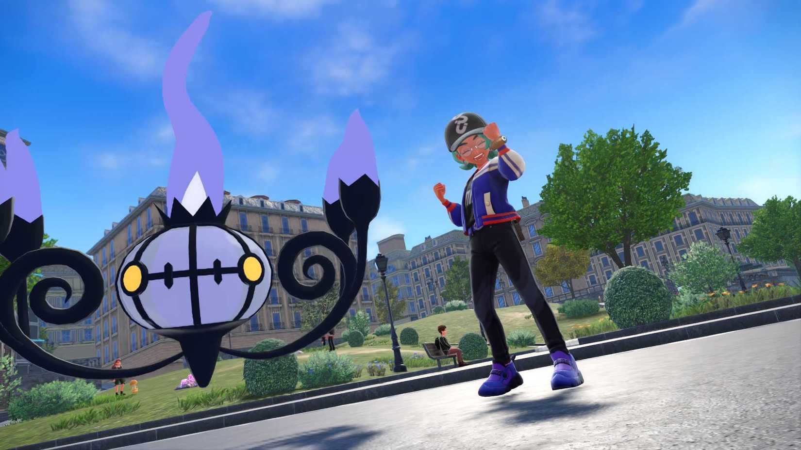 A trainer posing with his Chandelure in a screenshot from Pokemon Legends Z-A