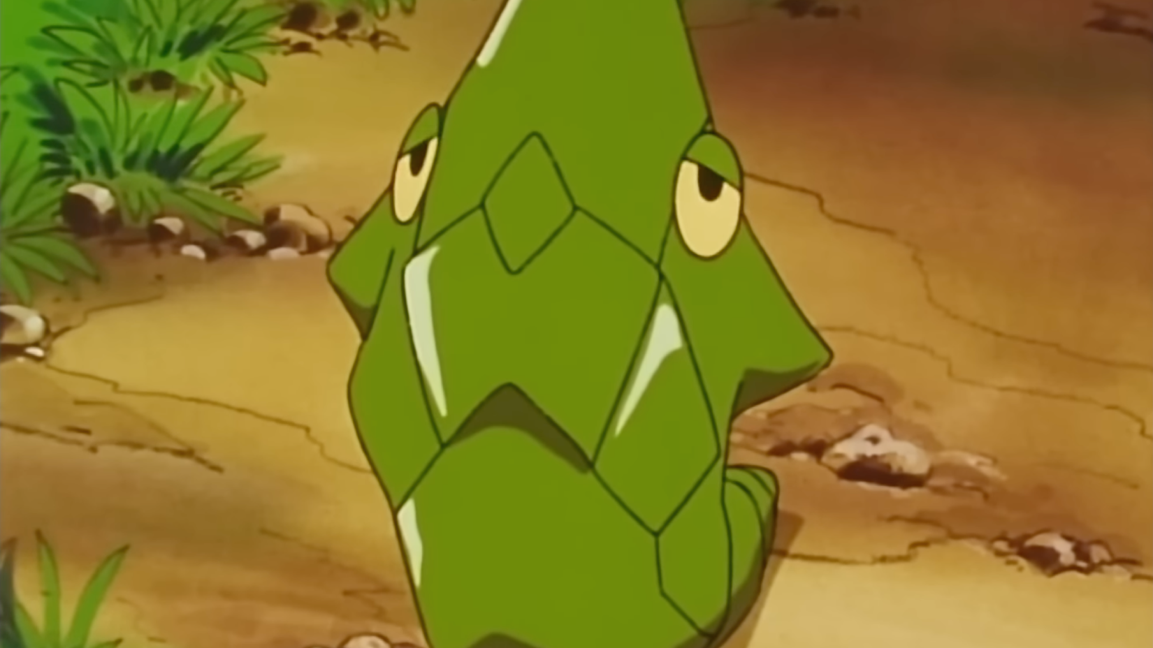 A close up shot of Metapod, a bug-type Pokémon that resembles a cocoon or chrysalis.