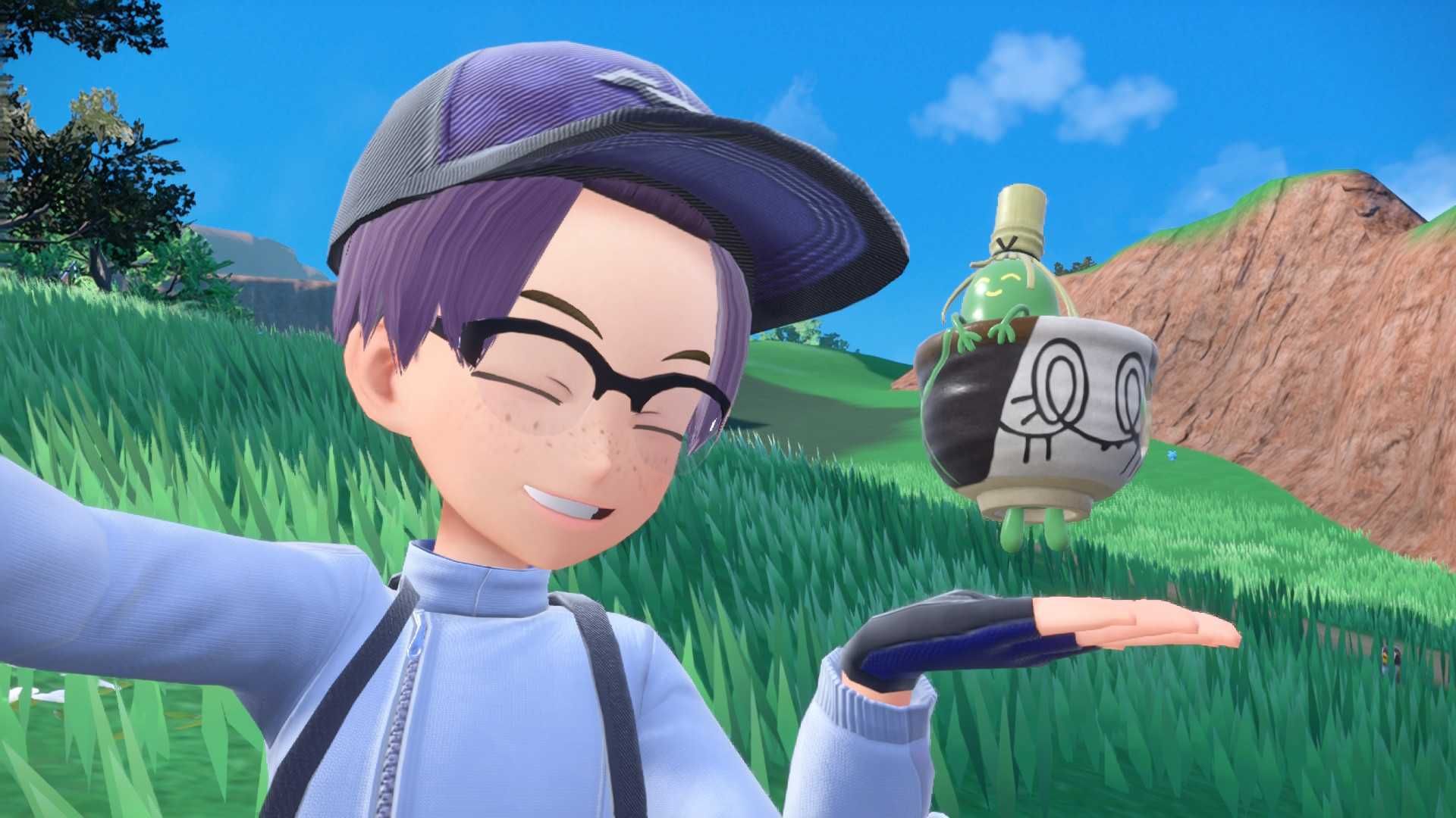 A trainer smiling with his Sinstcha, a Pokemon made of matcha and a cup, in a screenshot from Pokemon Scarlet