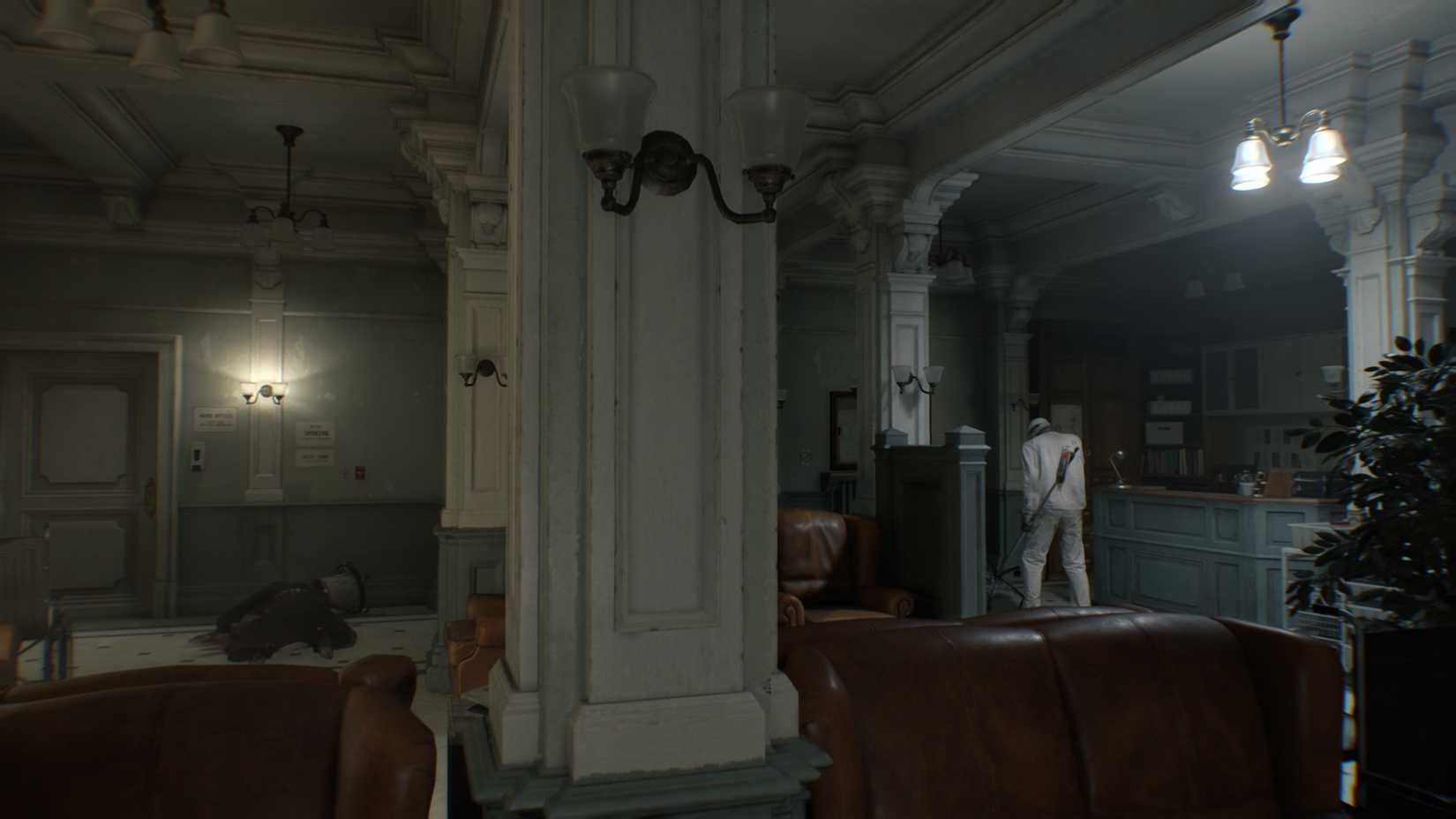 Two zombies in the east wing waiting room in Resident Evil Requiem