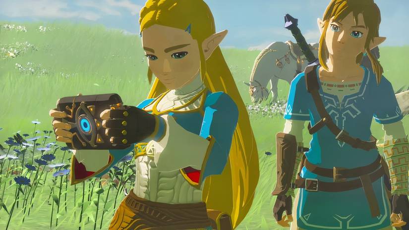 Zelda holding her Sheikah Slate in a memory with Link from the Breath of the Wild game