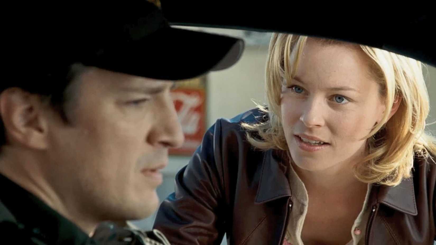 An image featuring Nathan Fillon and Elizabeth Banks from Slither 2006.