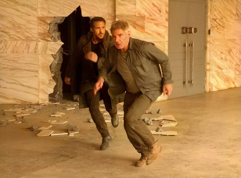 Harrison Ford running through a sand-colored marble room in Blade Runner 2049