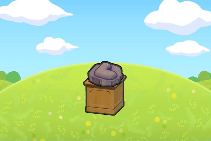 A jaw fossil, which looks like an arrow embedded on a rock, sitting on top of a pedestal on a grassy hill in Pokémon Pokopia.