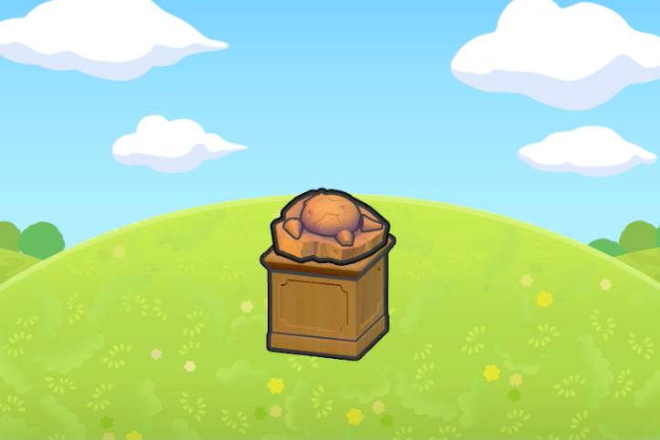 A skull fossil, which looks like the top of the head of a Cranidos, on a pedestal in Pokémon Pokopia.