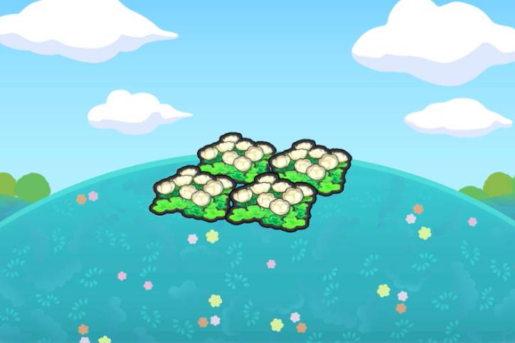 Four white flower patches on top of a grassy hill in Pokémon Pokopia.
