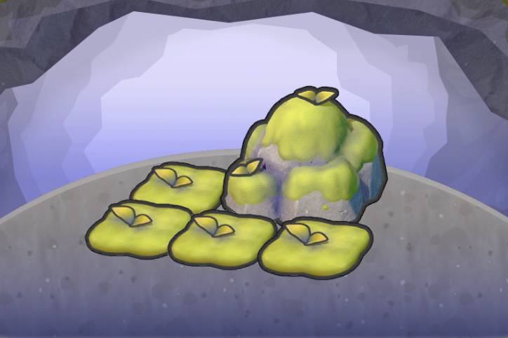 Four squares of moss near a mossy rock in Pokopia.