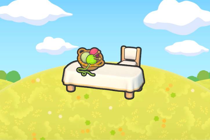 A basket of yarn on a table in Pokopia.