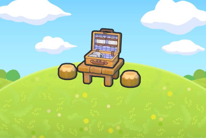 A picnic basket on a table with two chairs in Pokopia.