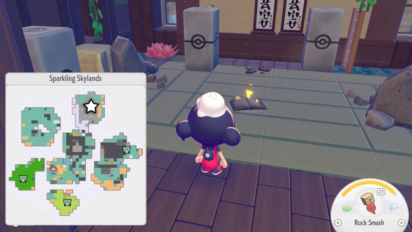 A book on the floor of an abandoned dojo in Pokopia.