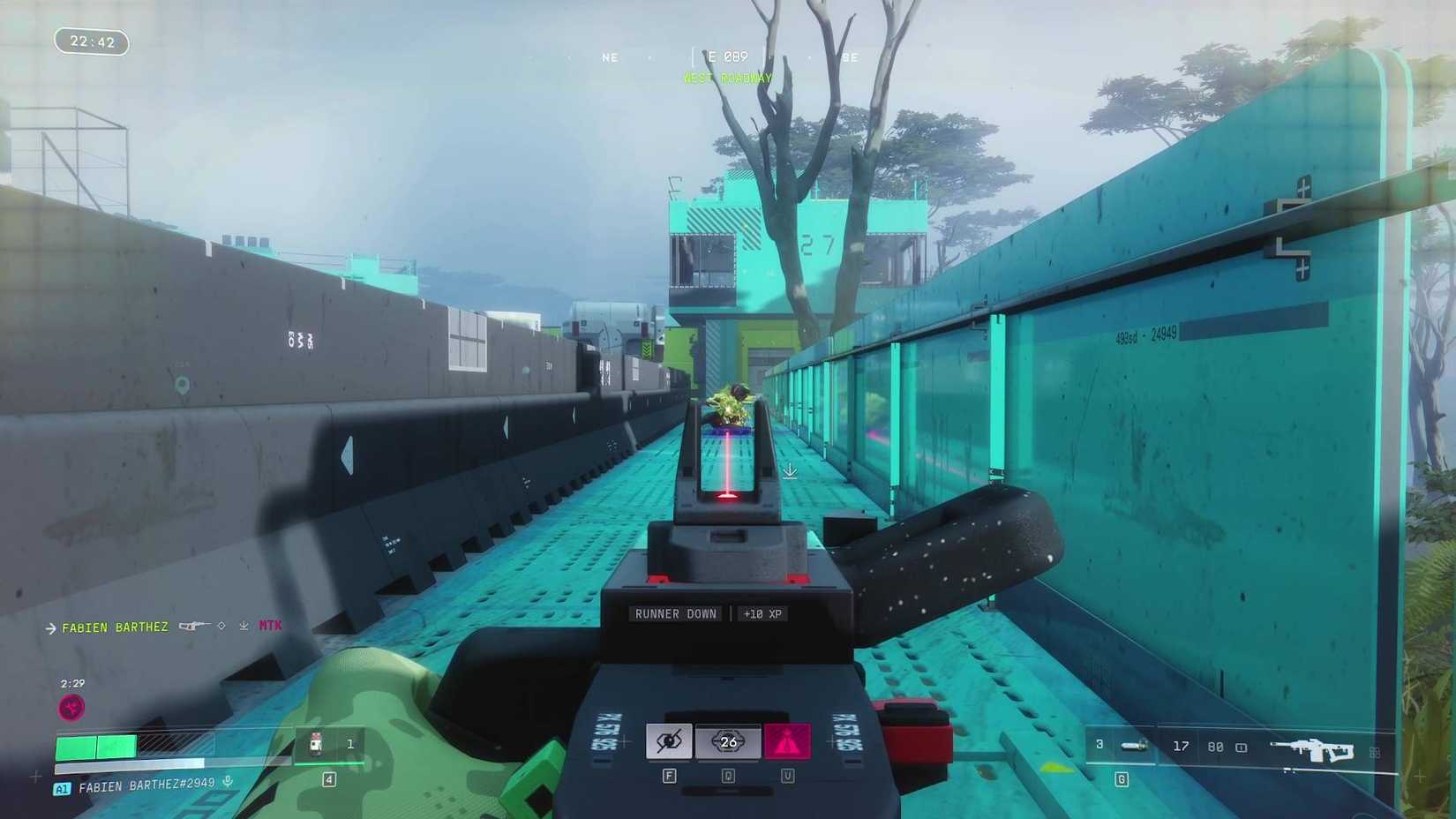 The player in Marathon aiming down the sights at an enemy knocked down on the floor.