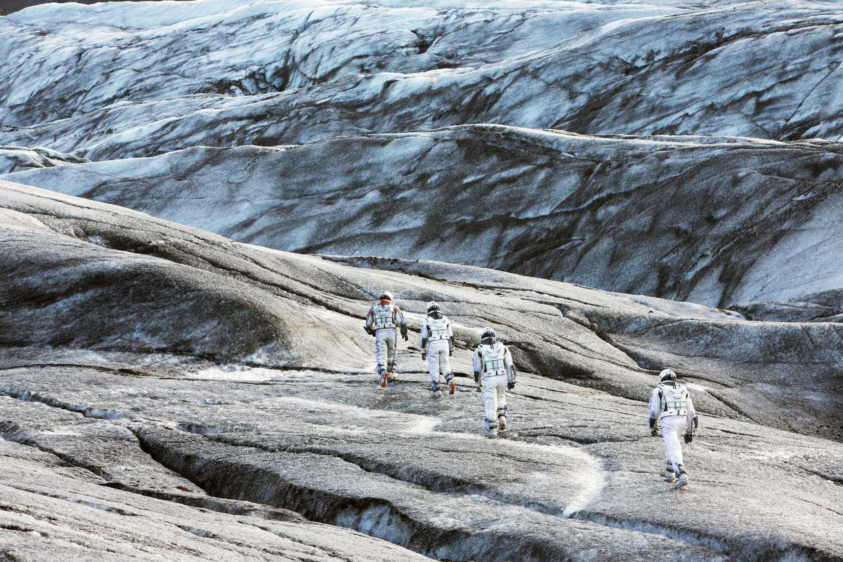 Interstellar cast walks on a white alien desert planet