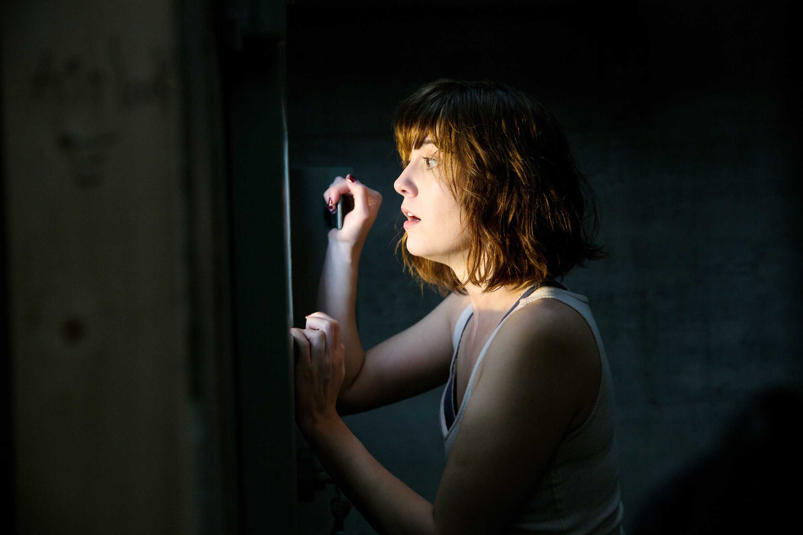 Michelle looks out a window to the outside world