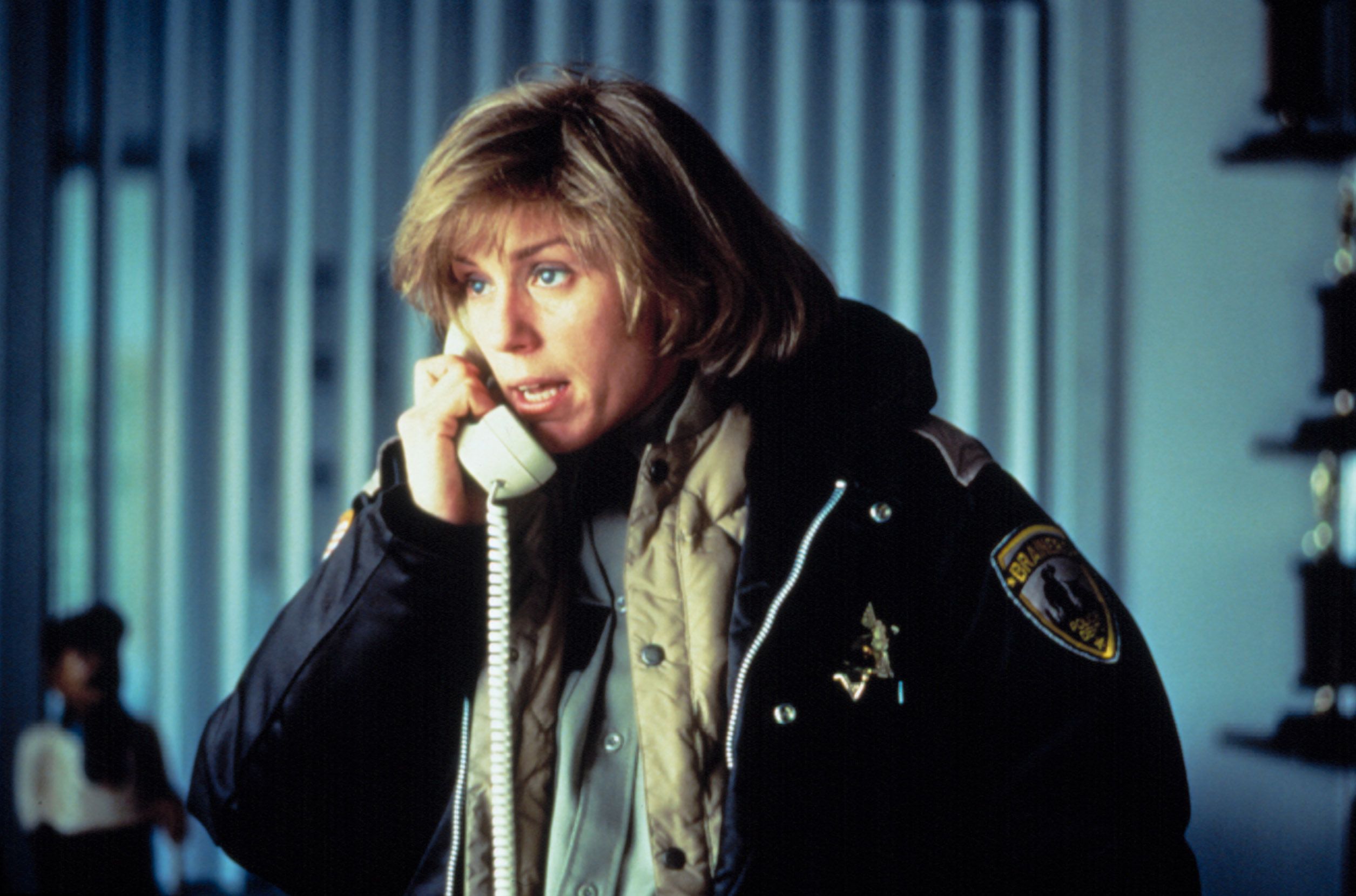 Frances McDormand as police chief Marge Gunderson, on the phone, wearing a heavy jacket, in Fargo