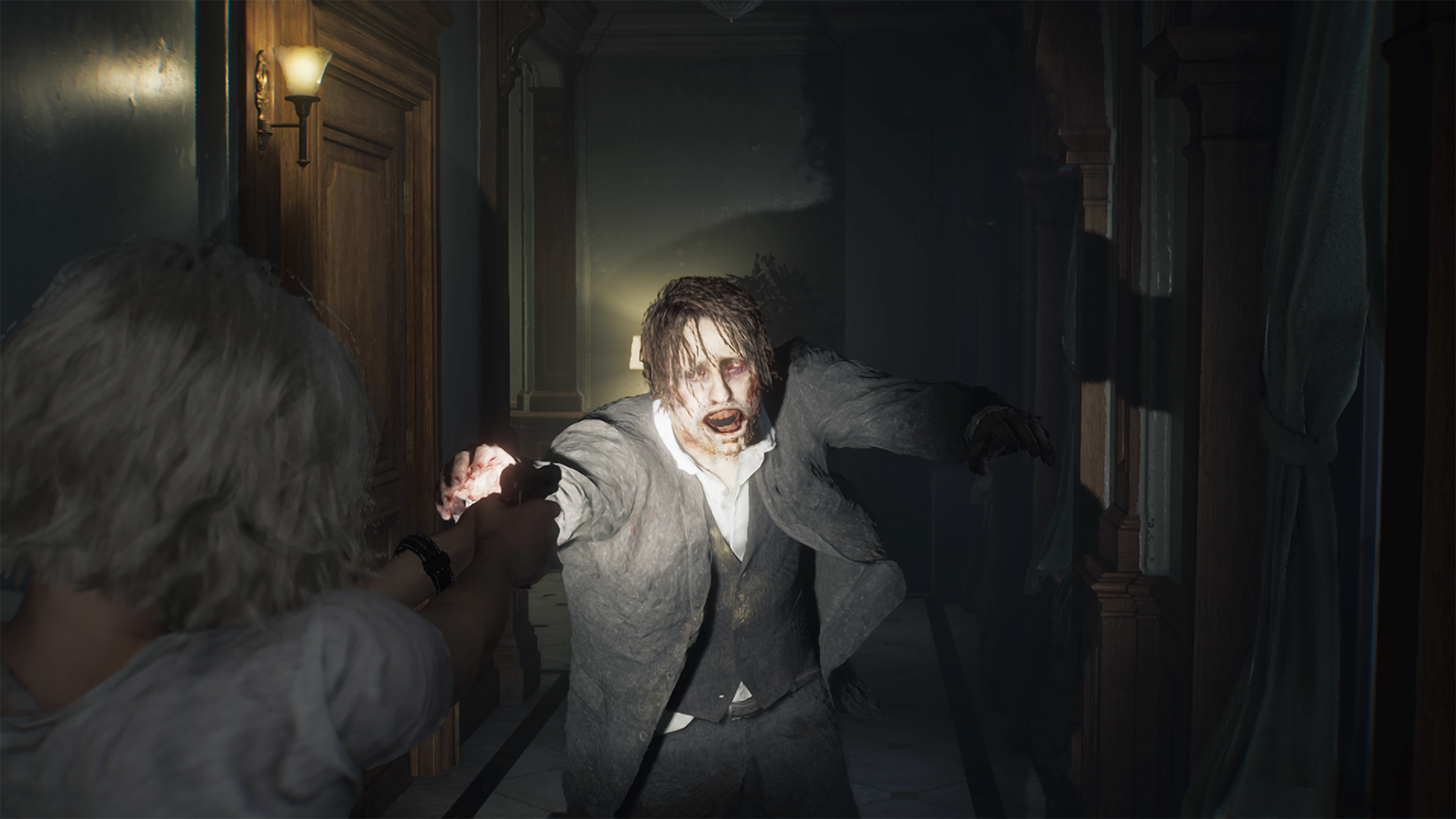 Grace levels a gun at an approaching zombie highlighted in her flashlight in Resident Evil Requiem