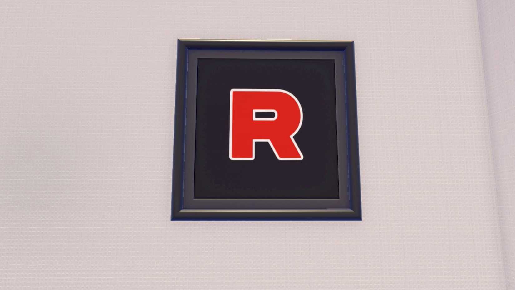A large framed Team Rocket logo (the capital red R) in Pokopia.