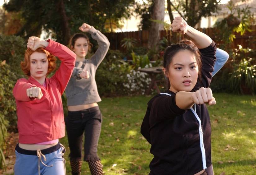 Three Potential Slayers strike a martial arts pose, Felicia Day as Vi stands on the left