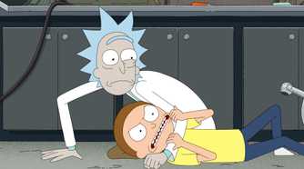 Rick looks worried as he wrestles Morty to the floor in his garage lab