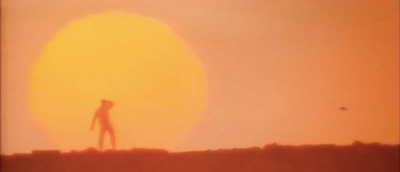 A silhouette against a sunrise