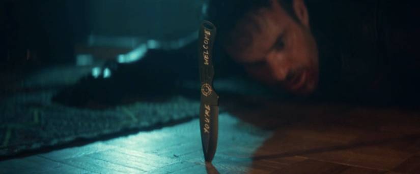 Daredevil looks at a knife that reads "You're welcome" with Bullseye's signal