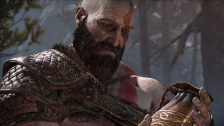 Kratos stares at an urn in God of War