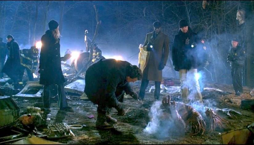 Walter Bishop (John Noble) examines a porcupine-like monster in a field strewn with plane wreckage in the Fringe episode "The Transformation"