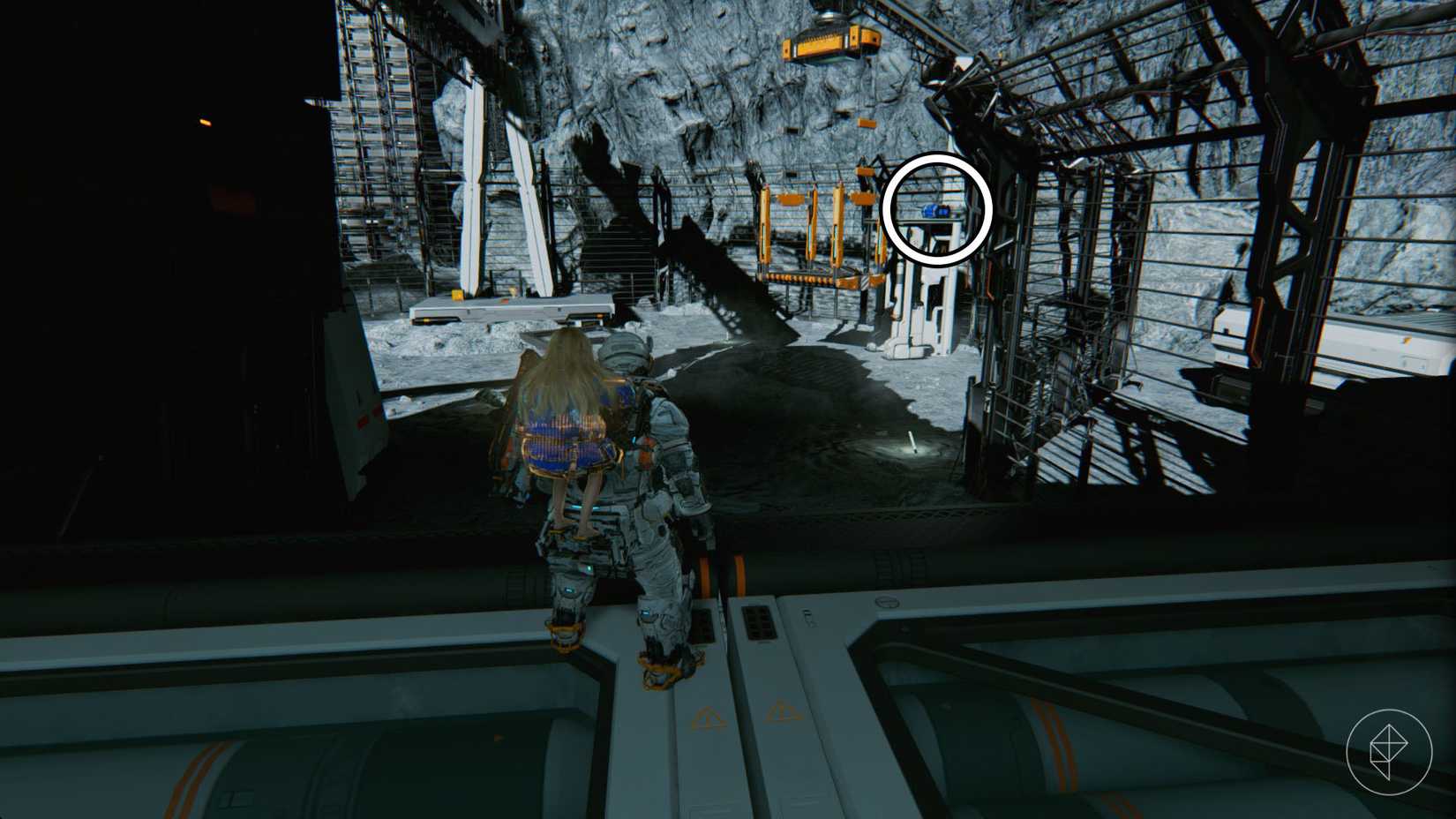 A man carrying a girl on his back looking toward a crane and a blue chest on the moon.