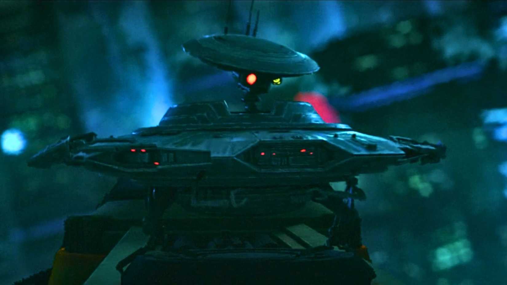 An image from Maul Shadow Lord episode 1. It features Spybot, a insect-like droid with an oval body and an oval-like helmet on. 