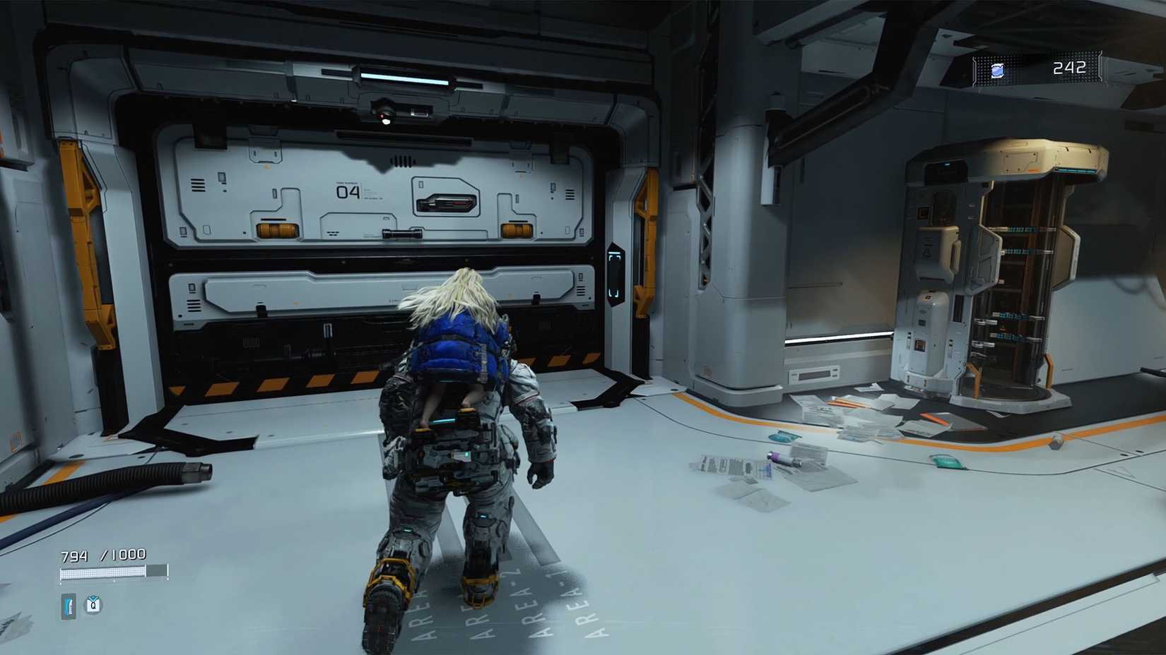 A girl on a man's back standing front of a large white door with the text "04" on it.