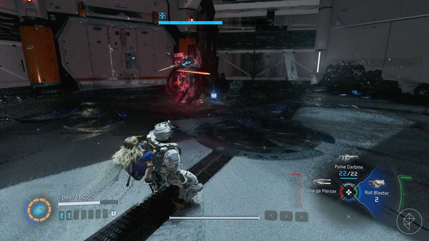 A man carrying a girl on his back sliding along the floor as a red robot sucks black particles towards itself in Pragmata.