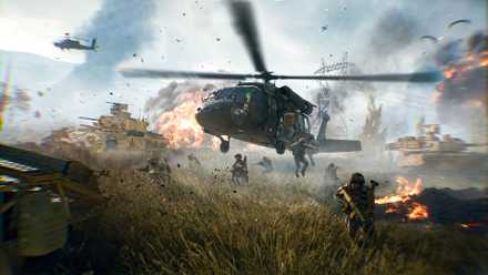 A helicopter landing in Battlefield 6 amid tanks and explosions, with soldiers jumping out onto the grass.