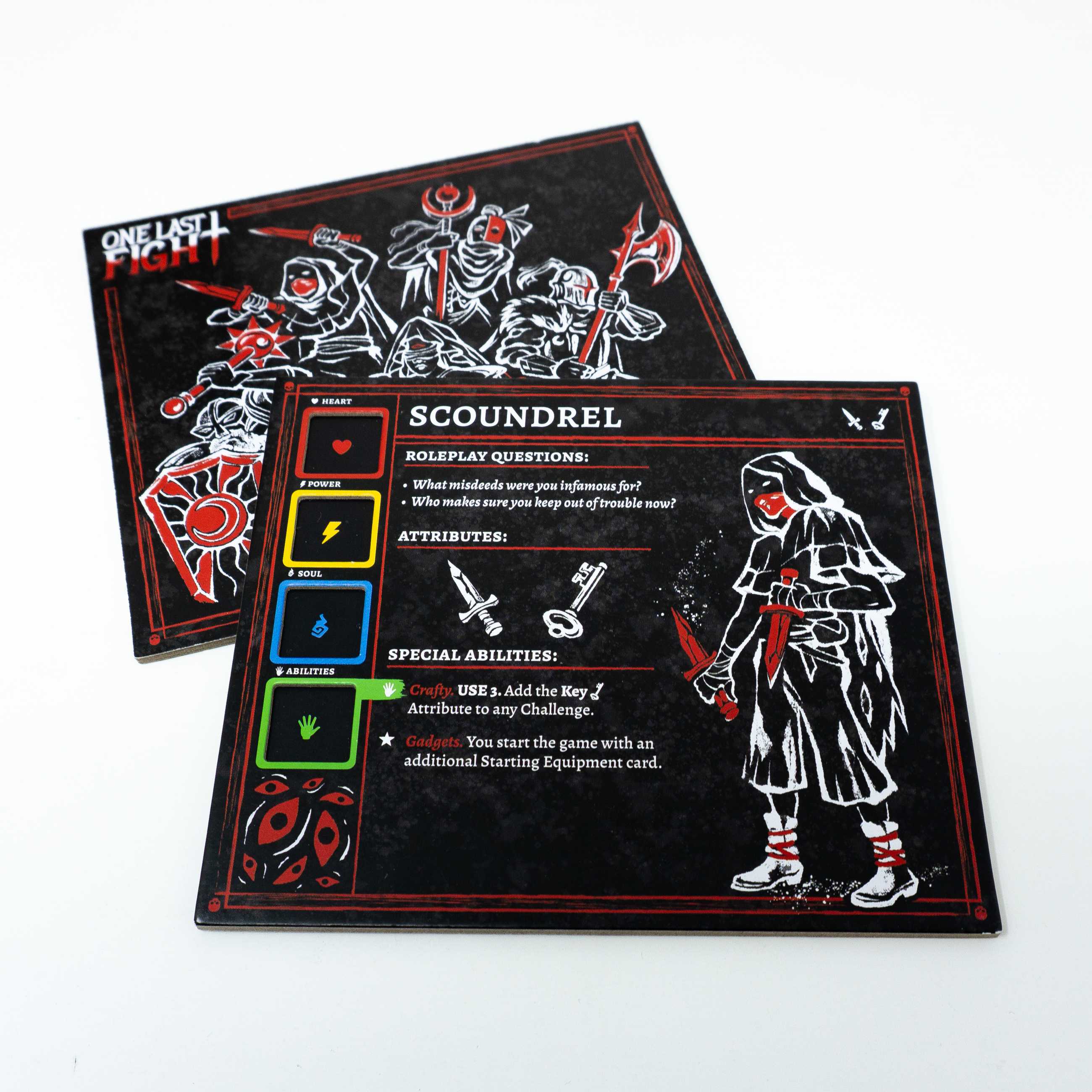 The Scoundrel character card from the TTRPG One Last Fight, showing a masked figure holding two daggers, next to a series of boxes for the skills Heart, Power, Soul, and Abilities