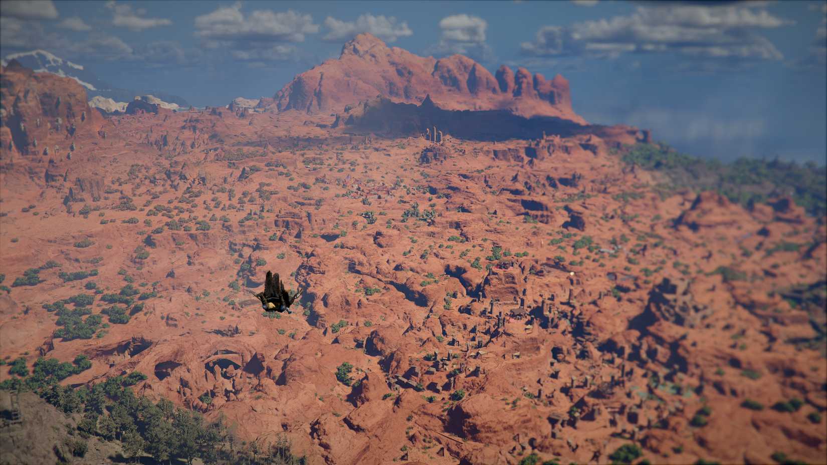 Kliff falls down toward the Crimson Desert.