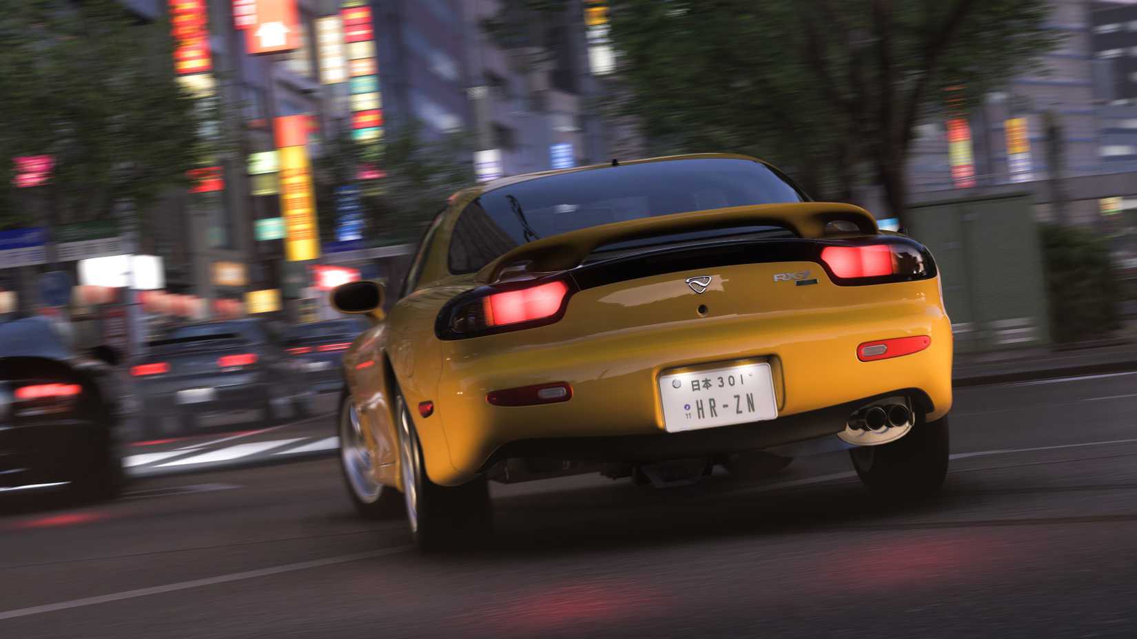 A Mazda RX7 races through Tokyo streets at night in Forza Horizon 6