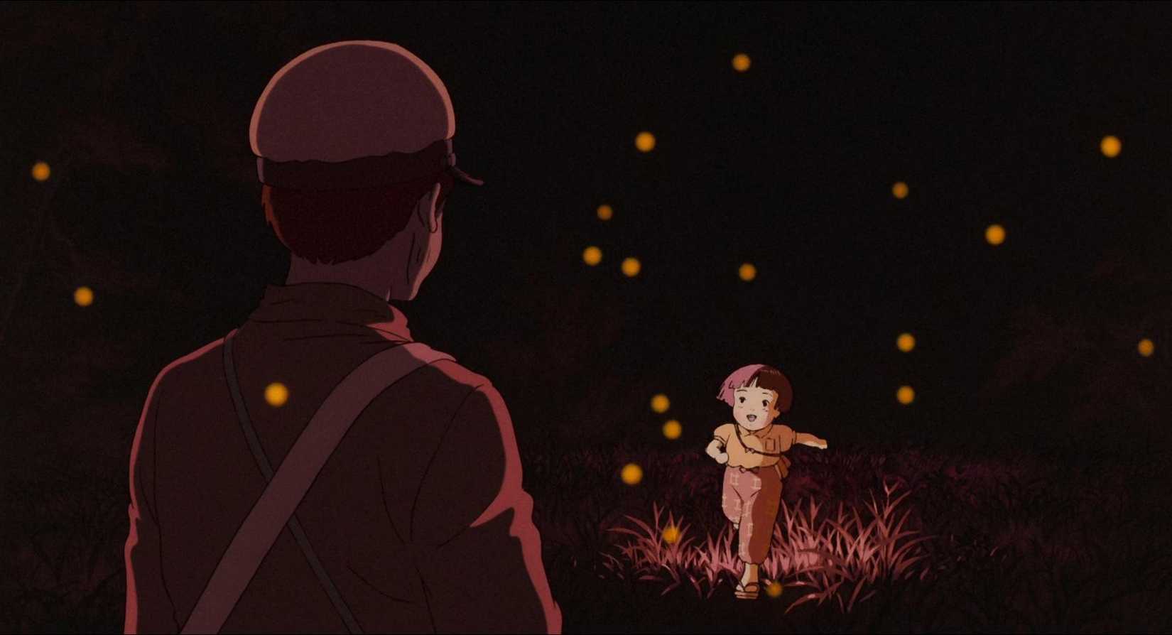 A small child runs and greets her older brother with a smile in Grave of the Fireflies