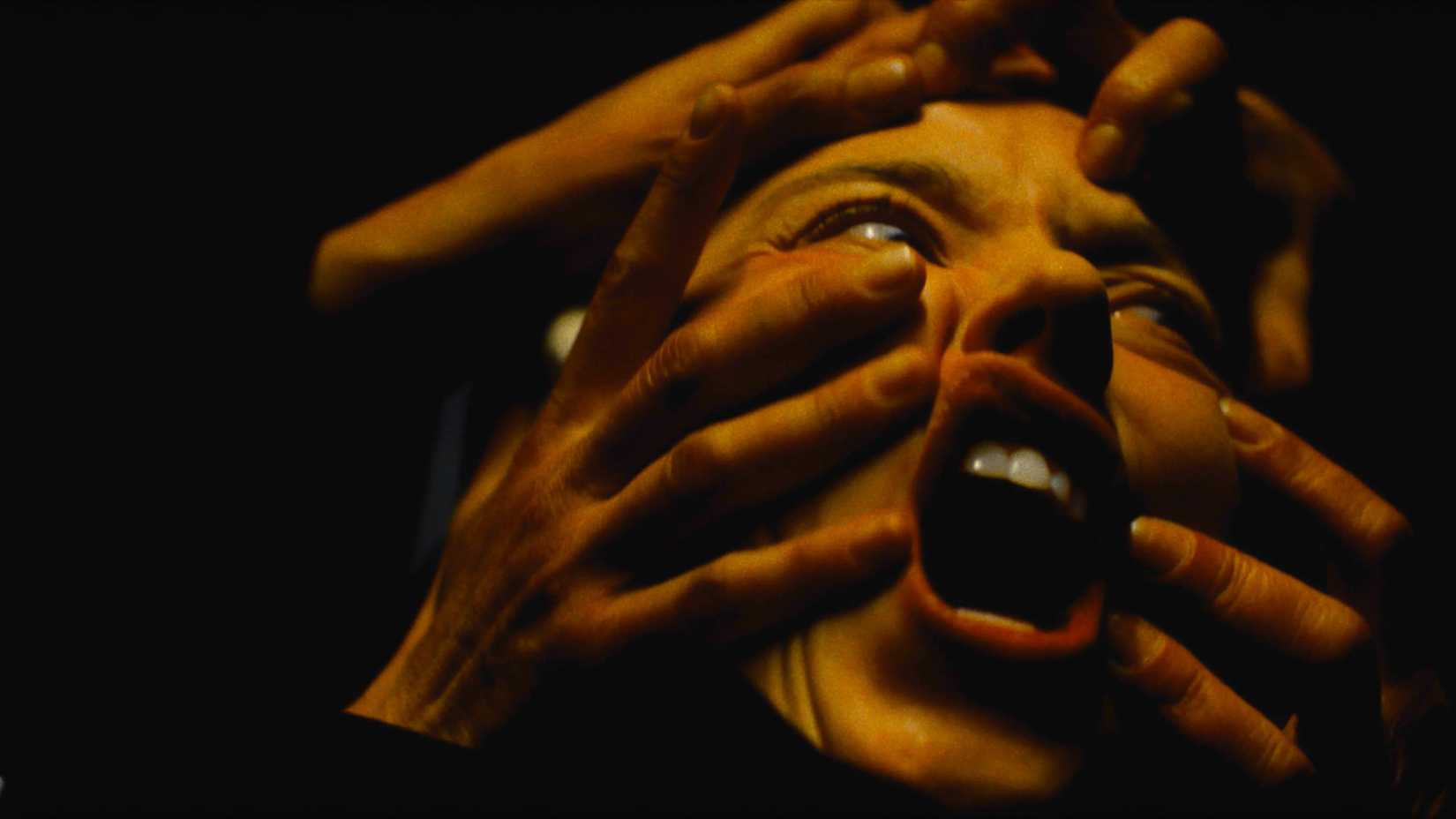 Disembodied hands grope Cecilia's face during the nightmare in Immaculate