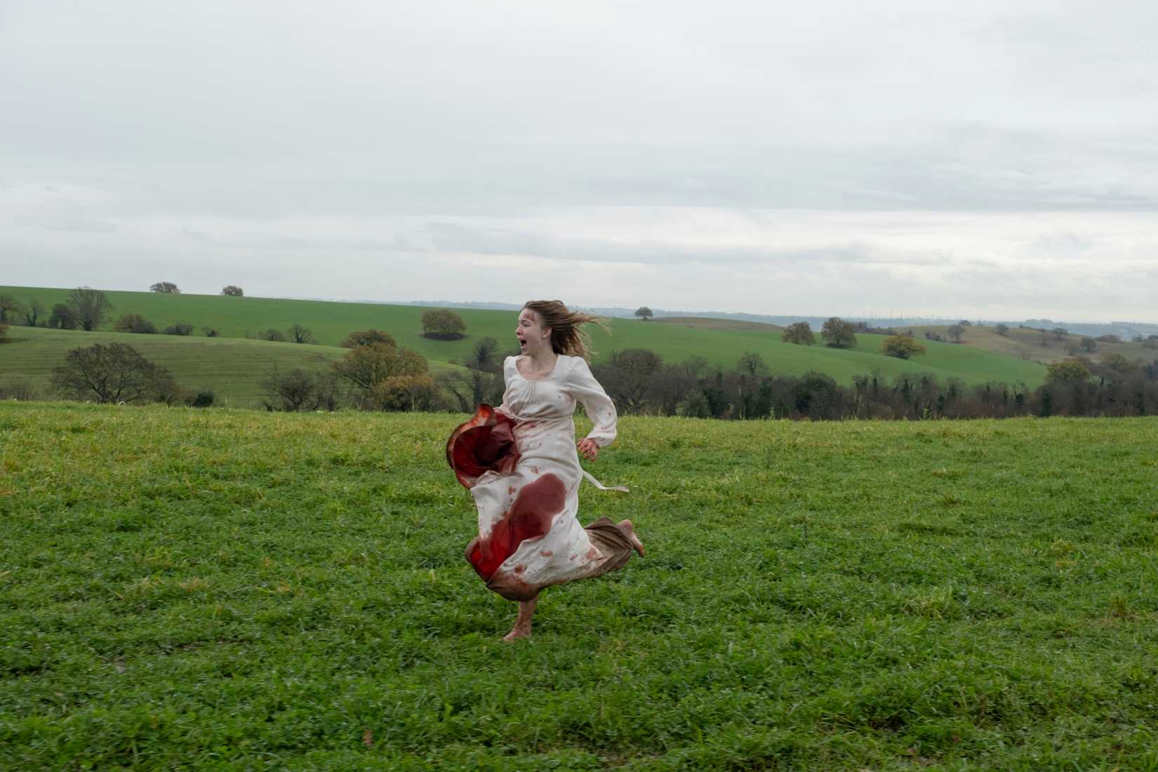 Cecilia tries to flee the convent in a blood soaked dress in Immaculate
