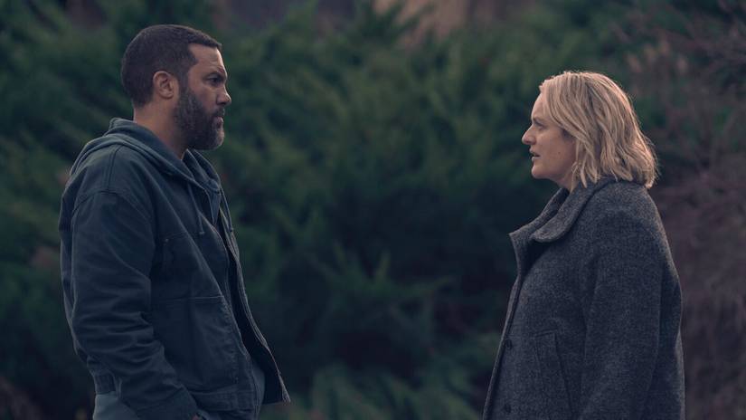 Luke and June from The Handmaid's Tale, two people in muffling, heavy grey coats, in deep conversation