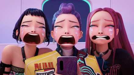 A screenshot from KPop Demon Hunters. It portrays Rumi, Zoe and Mira looking at a phone with tears running down their face.