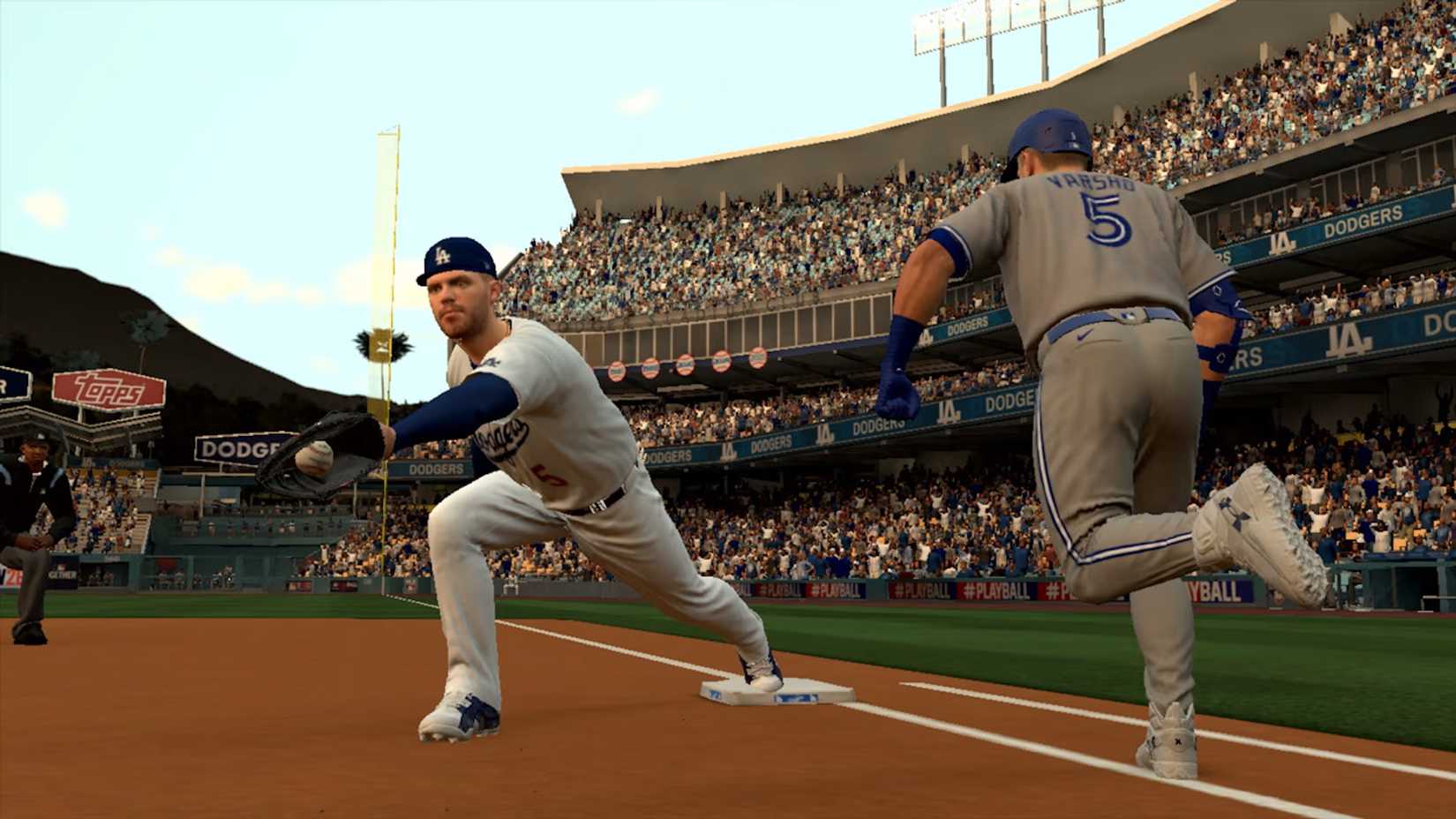 A defensive player catching the ball right before a member of the other team touches base in MLB The Show 26
