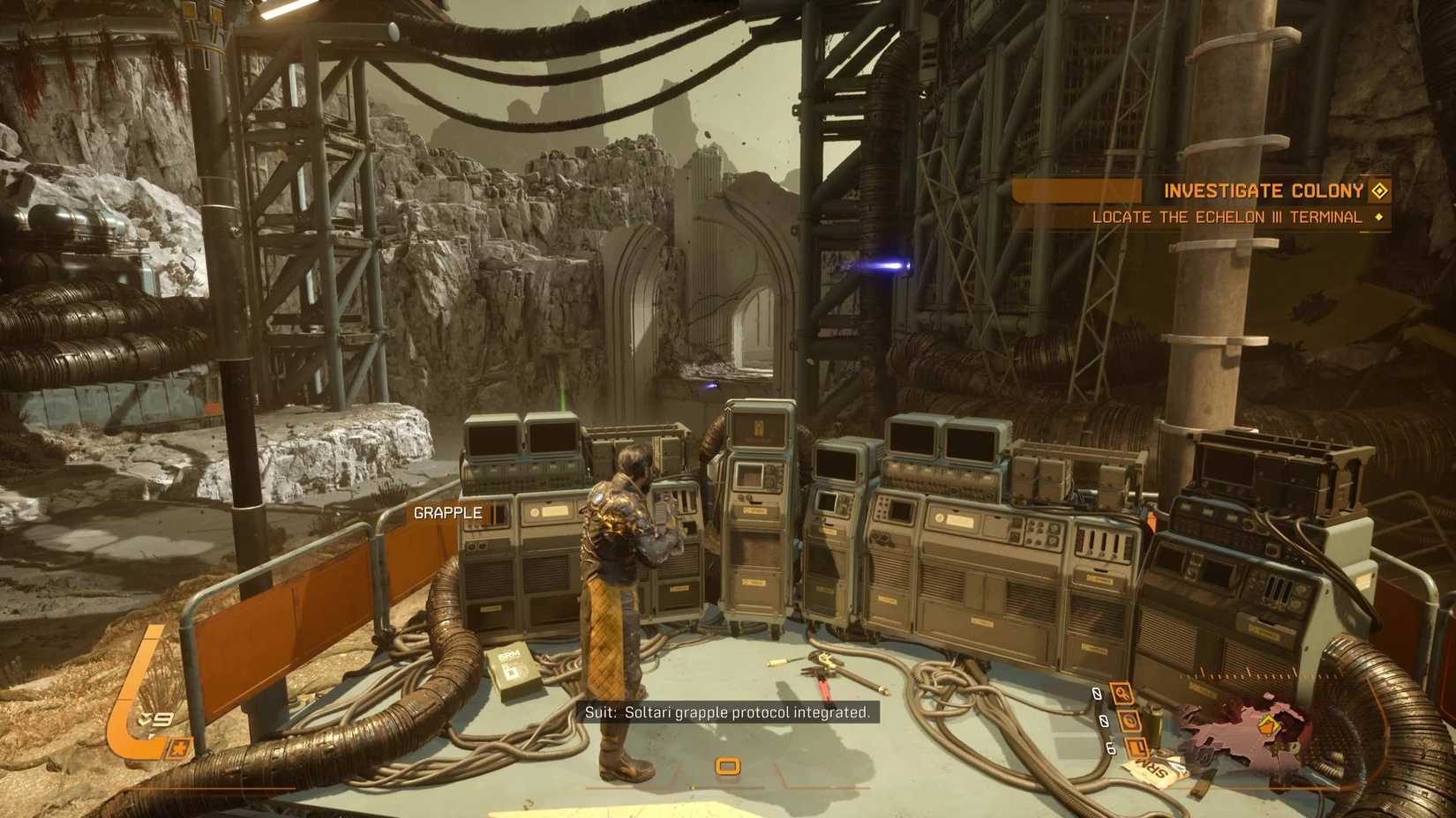 The player in Saros standing in front of the terminal that grants the grapple ability.
