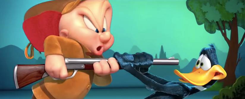 Elmer Fudd points a gun at Daffy