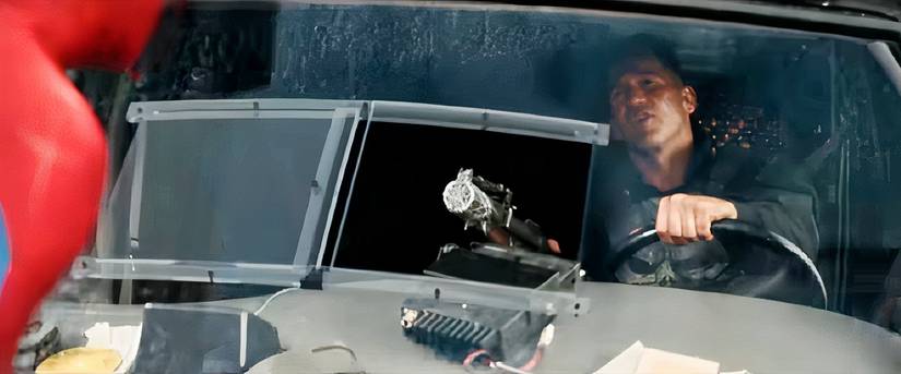 Punisher points a gun at Spider-Man