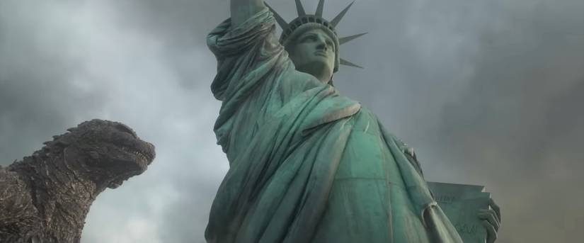 Godzilla beside the Statue of Liberty